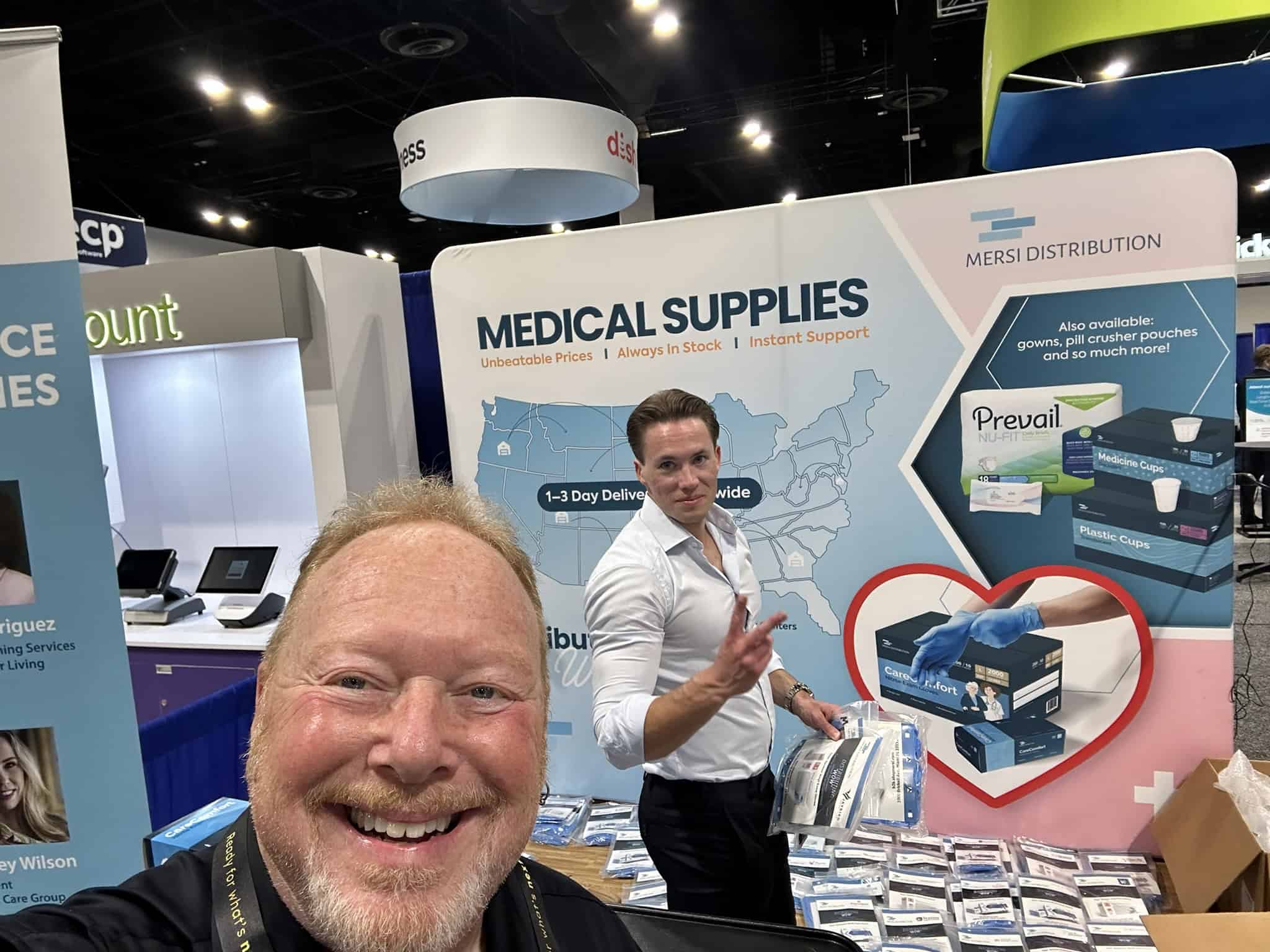 John Measner with the Mersi Distribution team at their tradeshow booth