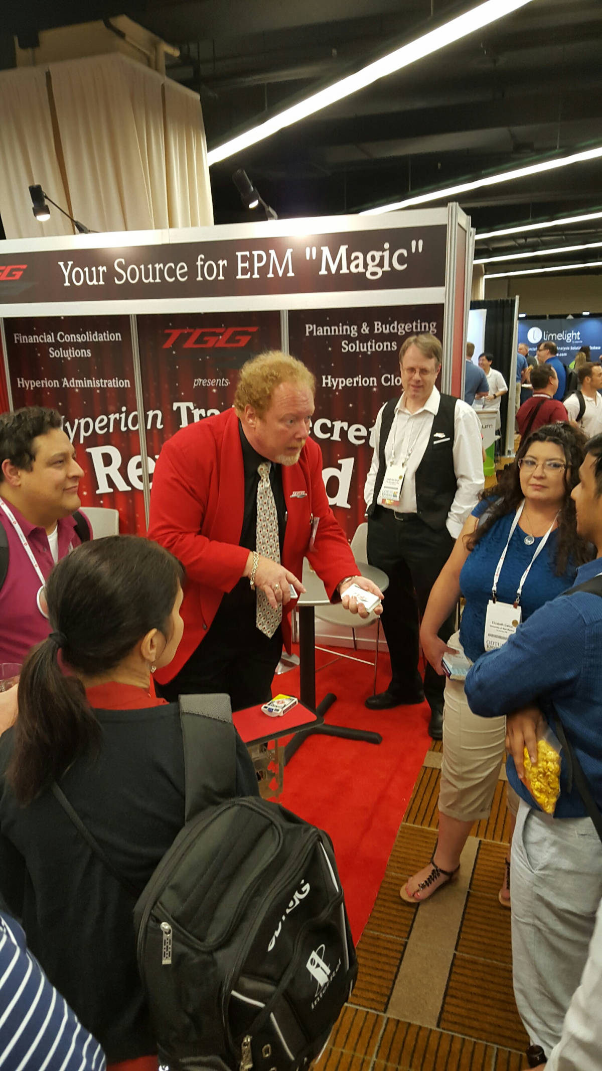 trade-show-magician-card-trick-booth-crowd John Measner performing at tradeshow booth